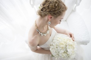 Bride sitting with a bridal bouquet